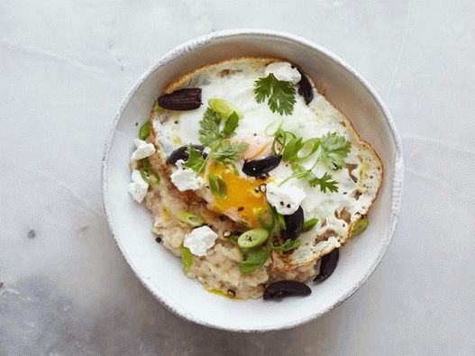 Turkish flavor: fried egg, crumbled feta, black olives, green onions and cilantro