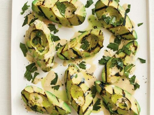 Grilled photo of avocado with tahini sauce