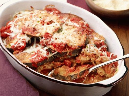Photo of baked eggplant with cheese in the oven