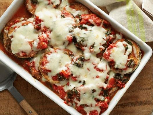 Photo of almonds breaded eggplant baked in tomato and kale sauce