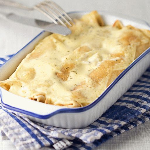 Photo Pancakes with mushroom filling, baked with cream sauce