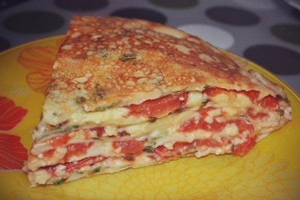 Pancake cake with tomatoes
