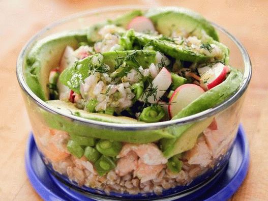 Photo of Bowl of spelled, salmon and vegetables