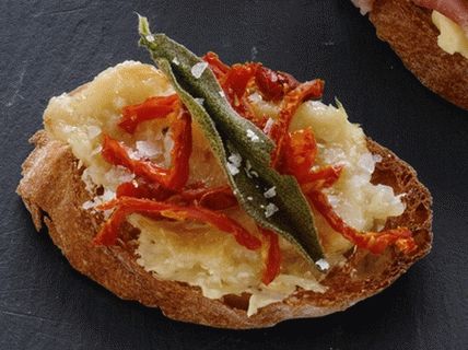 Photo of Bruschetta with garlic paste, dried tomatoes and sage