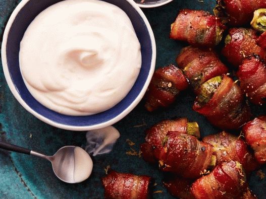 Photo of Brussels sprouts wrapped in bacon with lemon sauce
