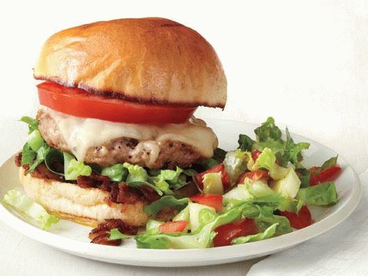 Photo Burger with pork chop and caramelized bacon