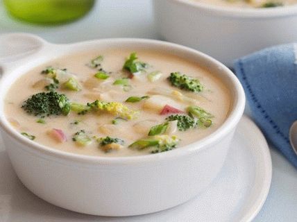 Photo of a chowder with broccoli and cheddar cheese