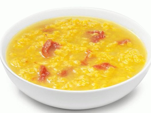 Photo Lentil soup with sun-dried tomatoes and curry