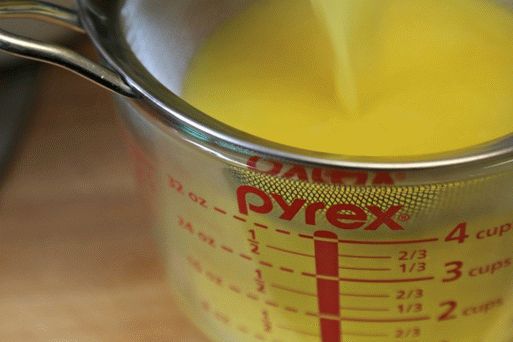 Strain lemon kurd through a sieve