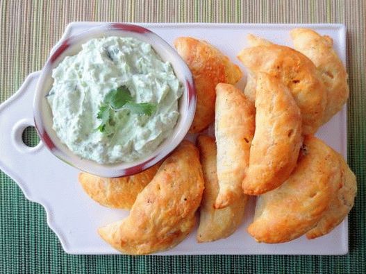 Photo Empanada with potatoes and chorizo