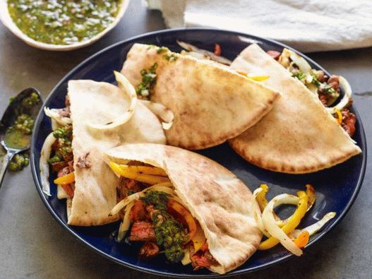Photo of Fajitos with beef and chimichurri sauce