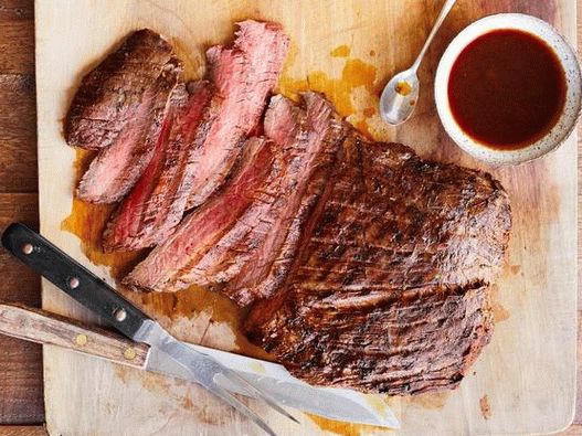 Photo of a flank steak in a grilled tequila, garlic and lime marinade