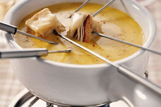 Photo of fondue with brie cheese and champagne