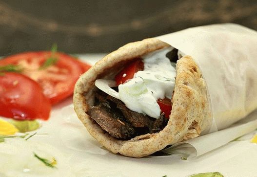 Photo of a gyro with lamb and tzatziki sauce