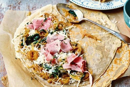 Photo Buckwheat pancakes with ham, Gruyere cheese and caramelized onions