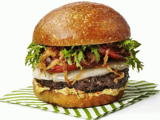 Photo Italian burgers with baked tomatoes and caramelized onions