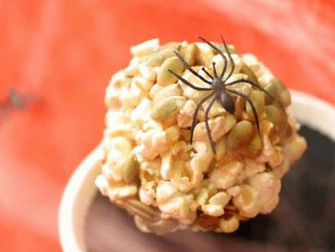 Sweet and spicy popcorn balls with pumpkin seeds