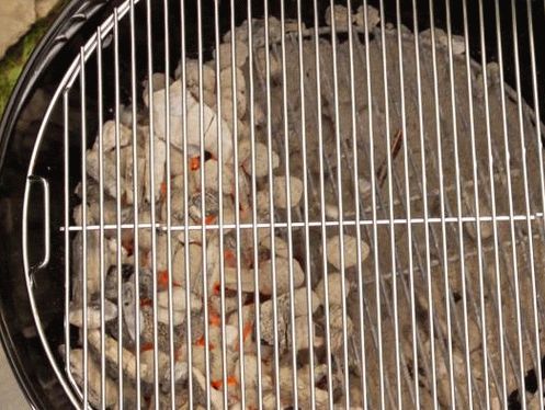 prepare the heating zones: move the hot coals to one side