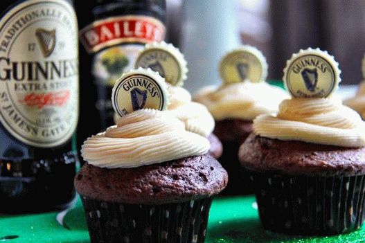 Photo of Cupcakes on dark beer with cream