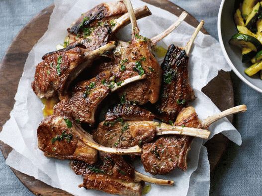 Photo of a rack of grilled lamb with rosemary