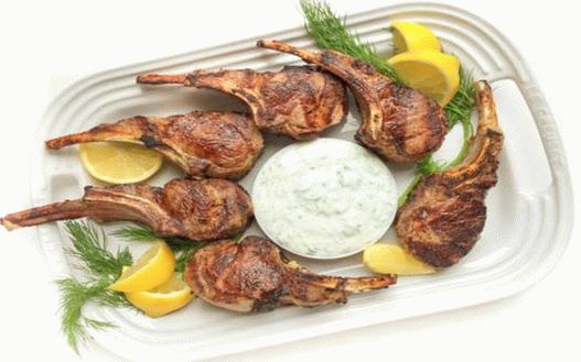 Photo of a rack of lamb with mint and yogurt sauce in Greek