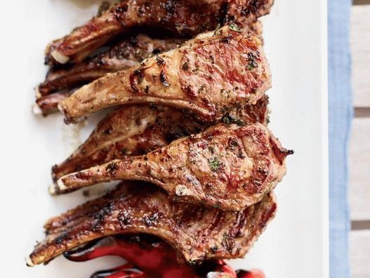 Photo of a rack of lamb with grilled garlic