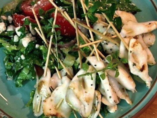 Photo of squid kebab with salad