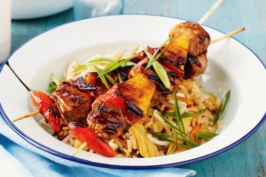 Photo of pork and pineapple kebab with side dish