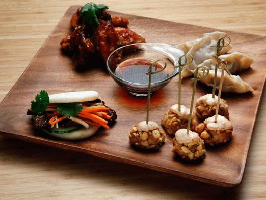 Photo of Chinese bao buns with pickled daikon, carrots and caramelized bacon