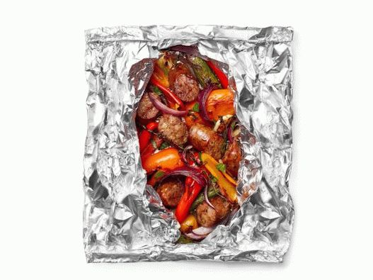 Photo of sausages and pepper with beer, fried in foil