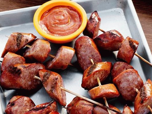 Photo of grilled sausages with spicy sauce