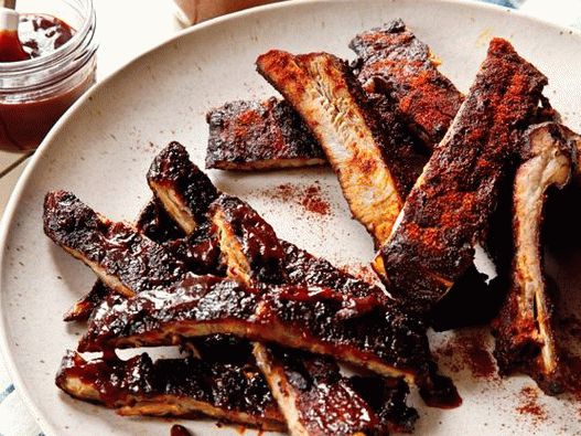Photo Smoked pork ribs with barbecue sauce