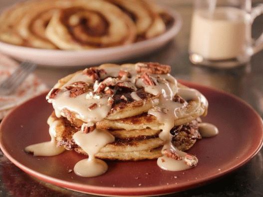 Photo of Cinnabon cinnamon pancakes buns with maple syrup and cream cheese glaze
