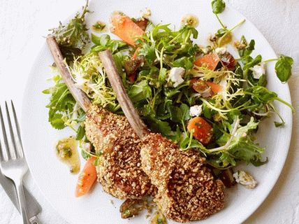 Photo Lamb chops on the bone in a nut mixture