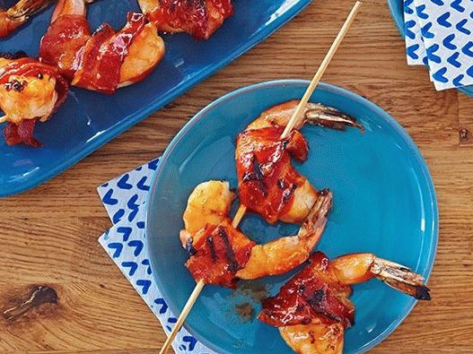 Photo of Shrimps in honey glaze wrapped in bacon, grilled