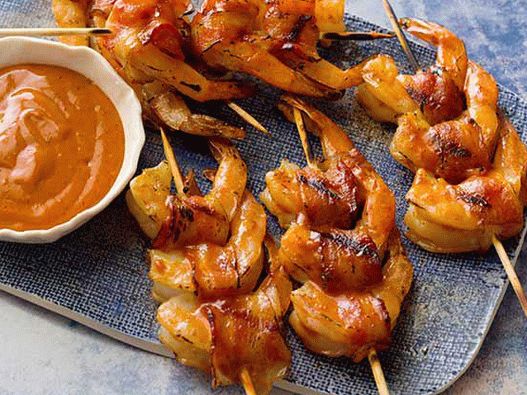 Photo of Shrimp wrapped in bacon, in the glaze of a barbecue