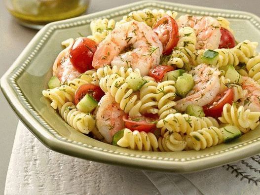 Photo Shrimp salad with pasta, cucumbers and tomatoes