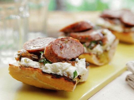 Photo of Crostini with grilled sausages and onions in balsamic syrup