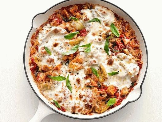 Photo of Parmesan chicken with artichokes in a pan