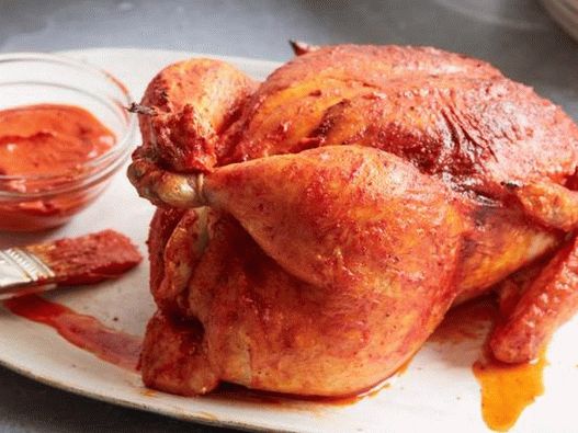Photo of a Chicken with Moroccan Harissa in the Oven