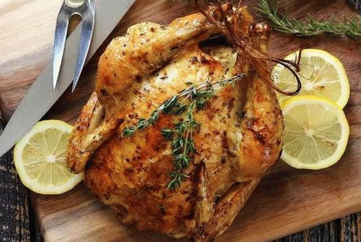 Photo Chicken in the oven with lemon and herbs
