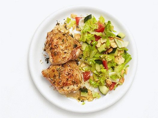 Photo Chicken thighs with sesame seeds and lemon