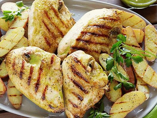 Photo of Chicken Breasts and Young Grilled Potatoes with Vinaigrette Sauce with Roasted Garlic and Oregano