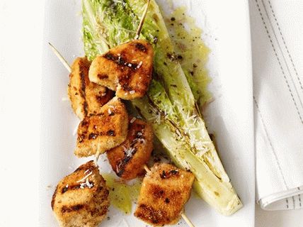 Photo of grilled chicken breasts and romaine romaine salad