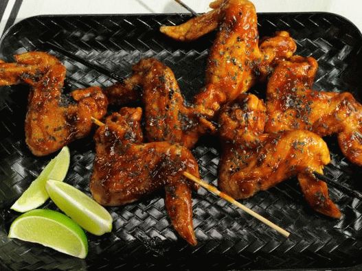 Photo of deep-fried chicken wings in barbecue beer sauce