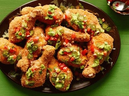 Photo Chicken legs breaded with corn chips and cheese