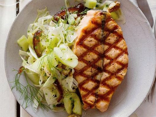 Grilled salmon photo with a salad of cucumbers and dates