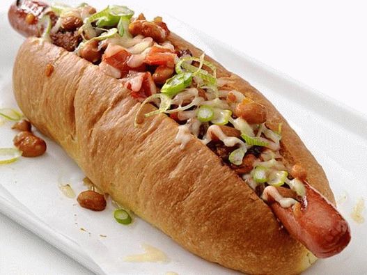 Hot dogs with cheese and chili and chipotle sauces