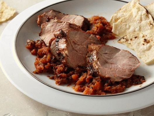 Grilled pork tenderloin with baked tomato and jalapeno salsa
