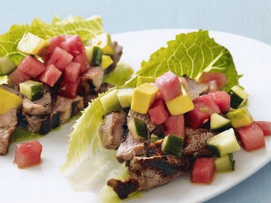 Tacos with pork and watermelon on lettuce